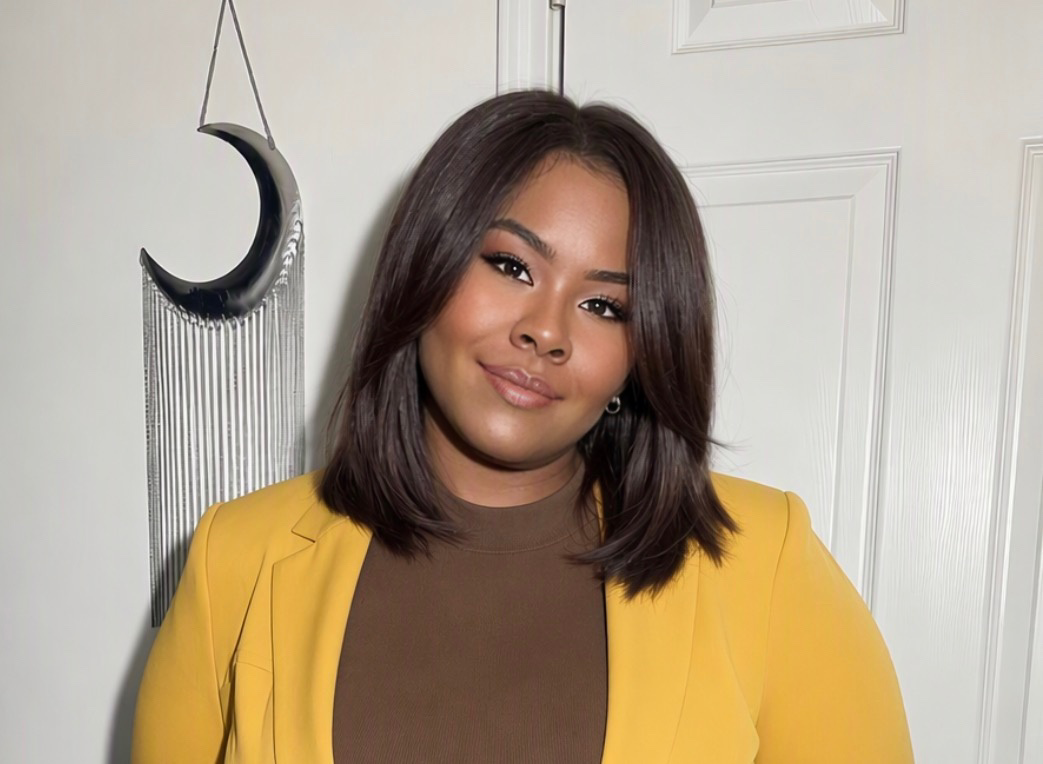 Chante Johnson in a black blazer posing in a professional setting